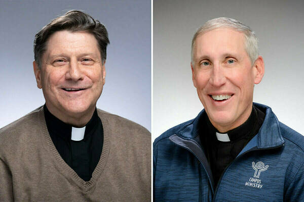 On the left, a white man with short light brown hair smiles for a portrait. He wears a clerical collar with a brown v-neck sweater over it. On the right, a white man with short white hair smiles for a portrait. He wears a clerical collar with a blue Campus Ministry quarter zip over it.